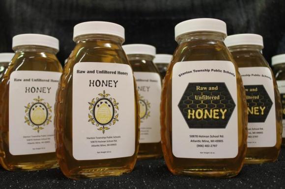 Through a Lake Superior Stewardship Initiative (LSSI) project, middle-school students at E.B. Holman School this month extracted 31.5 pounds of honey, which they filtered and bottled, from two bee hives. 