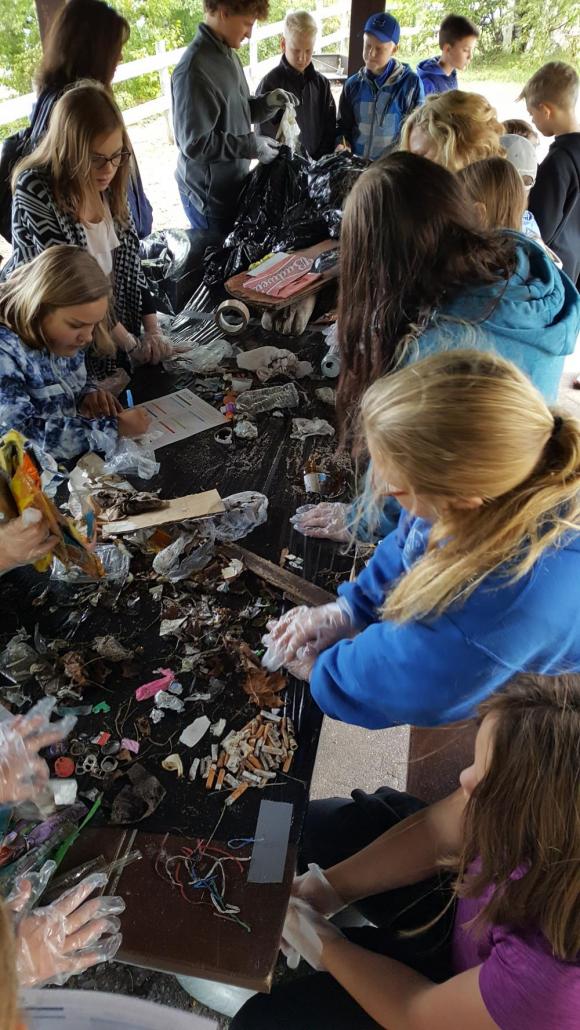 Students group the trash collected into categories such as plastic, glass, fast food containers,etc. and report their data to the Alliance for the Great Lakes Adopt-A-Beach Program.